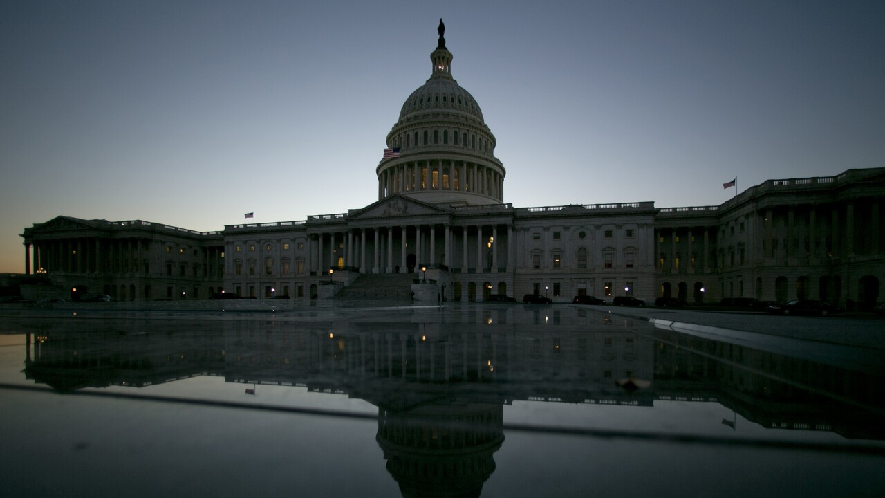 The U.S. Capitol building is reflected in Washington, D.C.