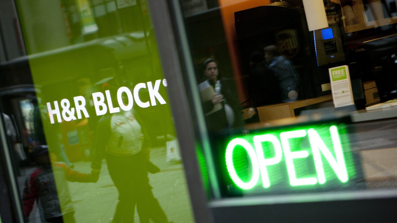 The H&R Block, Inc. logo is displayed in front of the company's flagship office in New York, U.S., on Friday, March 3, 2012. H&R Block, Inc. provides tax services to the general public, accounting and consulting services, and consumer financial and personal productivity software. Photographer: Scott Eells/Bloomberg 