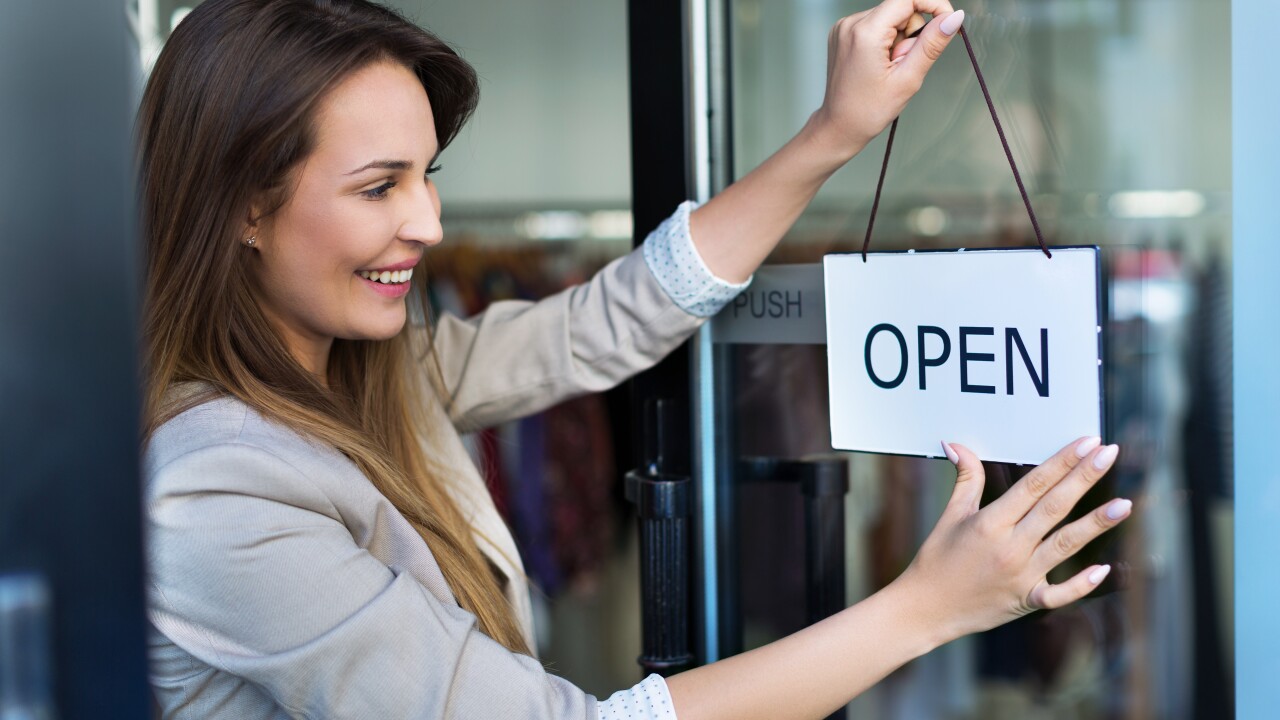 Open for business sign - woman