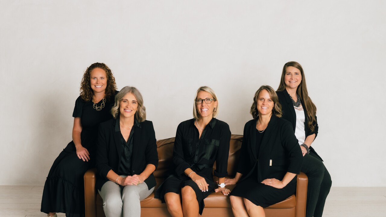 BookSmarts Accounting CEO Jenny Groberg (center) with some members of her team