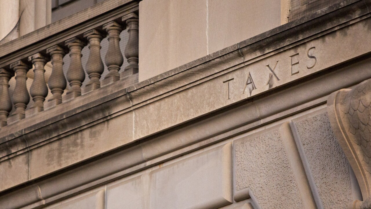 The word "Taxes" is seen on the facade of the Internal Revenue Service headquarters in Washington, D.C.