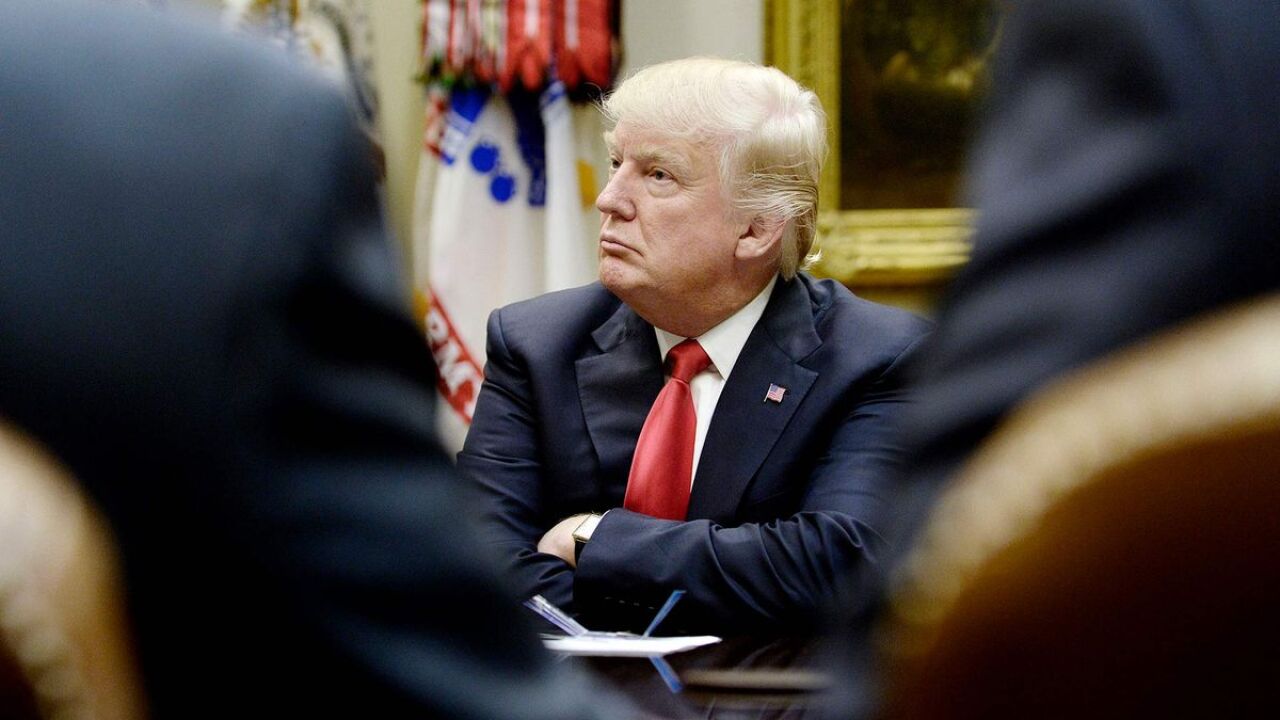 President Donald Trump listens during a meeting with the National Association of Manufacturers in the White House