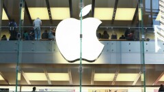 Customers shops in an Apple Inc. store in Sydney, Australia.