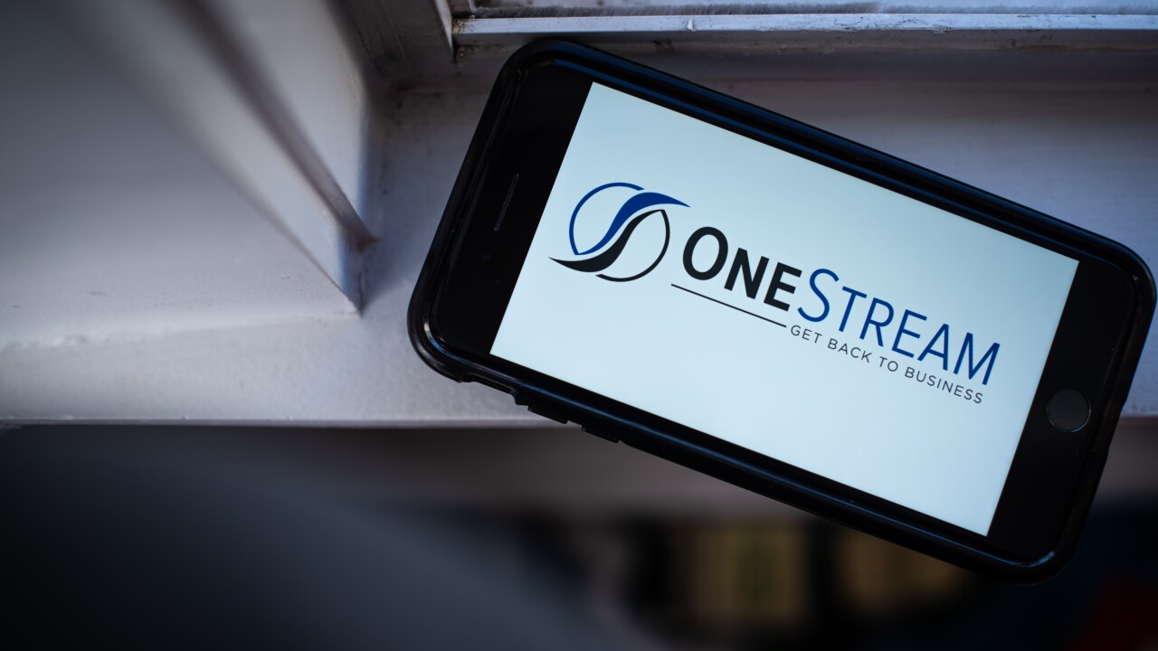 The OneStream logo is displayed on a mobile phone in an arranged photo