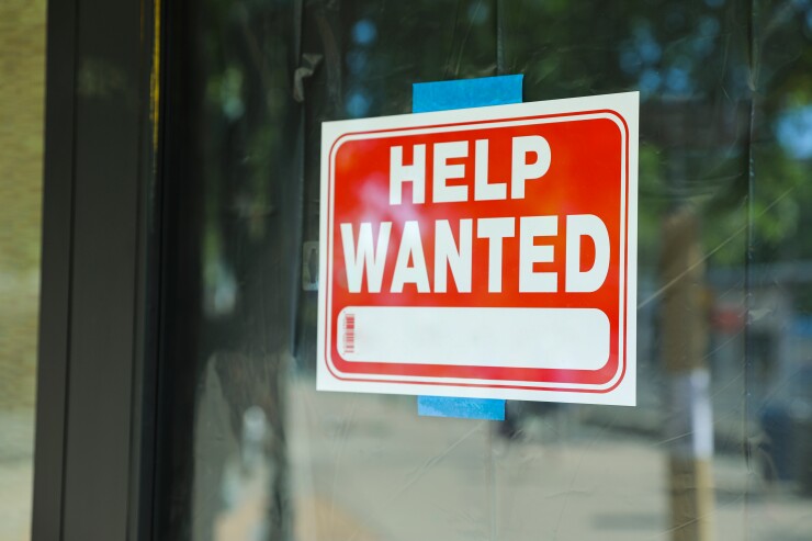 Help wanted sign in window