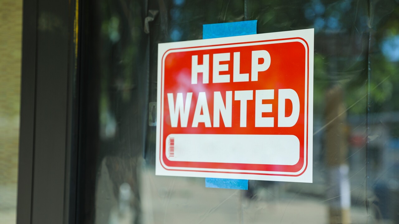 Help wanted sign in window