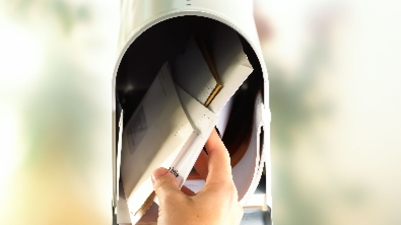 Hand with open mailbox